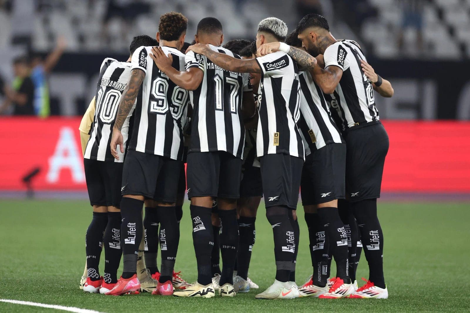 The Botafogo team in a huddle on the pitch